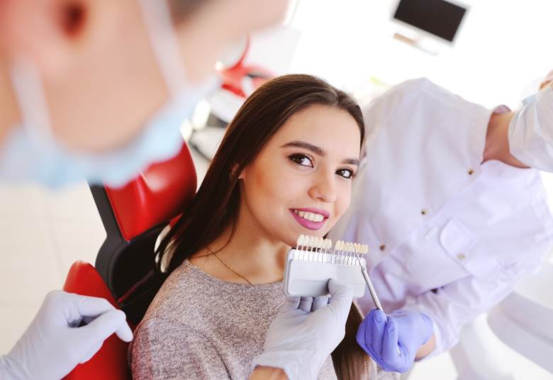 Woman receiving veneers in Toronto from dentists