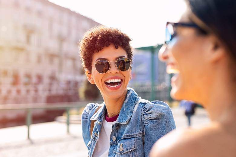 Woman with veneers in Toronto smiling outside