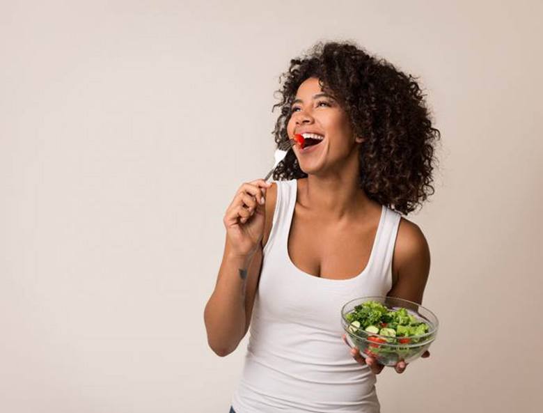 woman eating healthy for dental implant care in Toronto