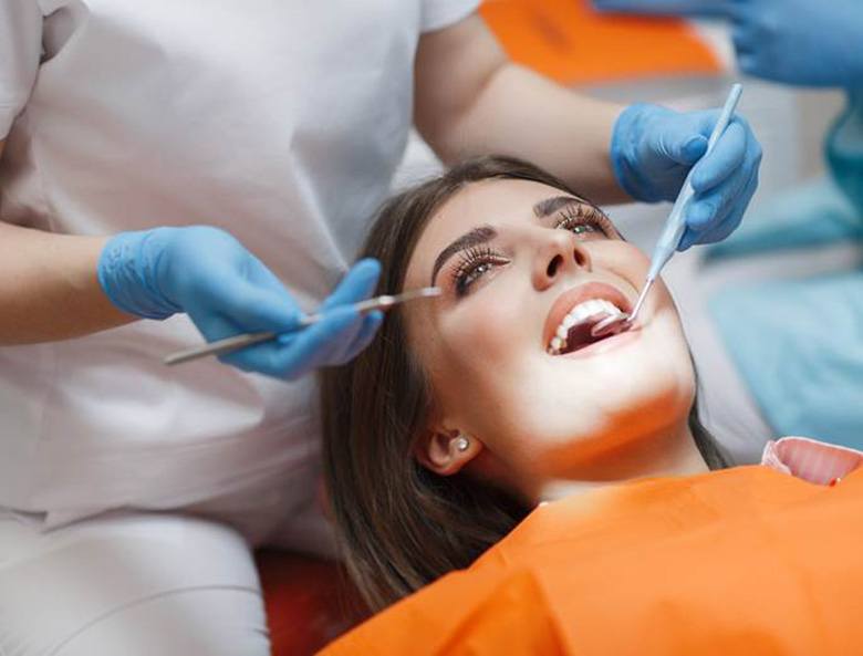 woman receiving dental implant care in Toronto