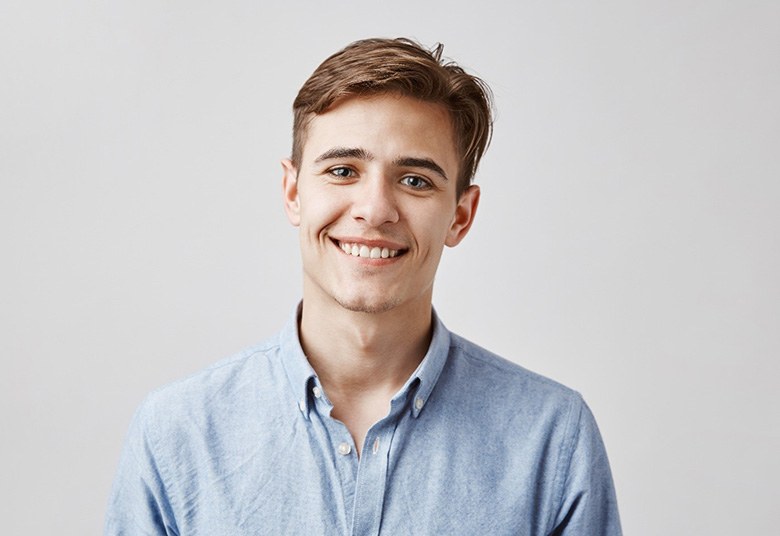 man smiling with veneers in Toronto