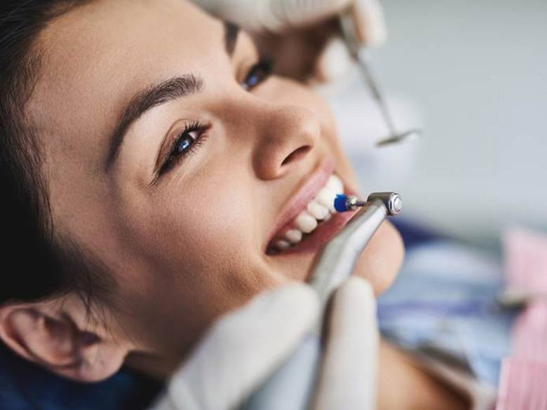 patient undergoing dental cleaning for teeth whitening in Toronto