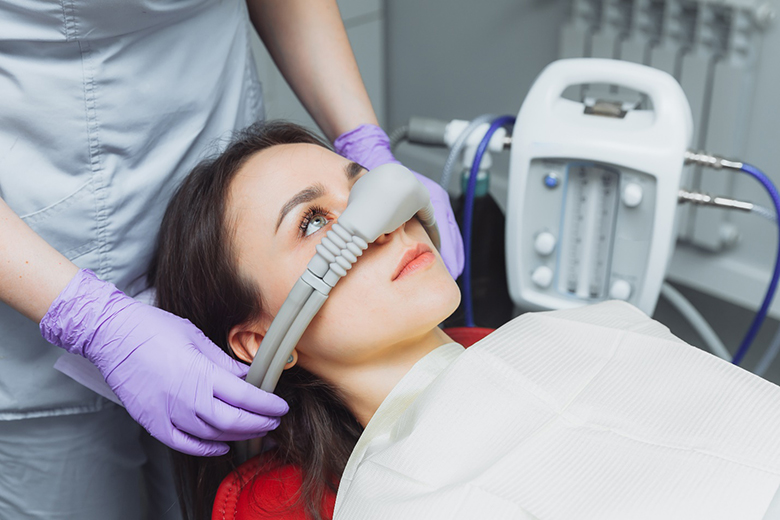 Woman being administered nitrous oxide