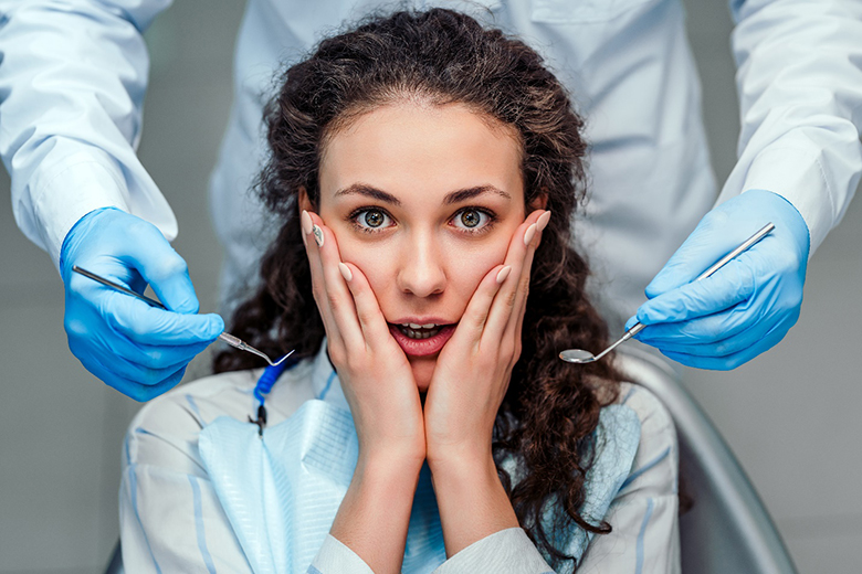 Woman with dental anxiety in the dental chair