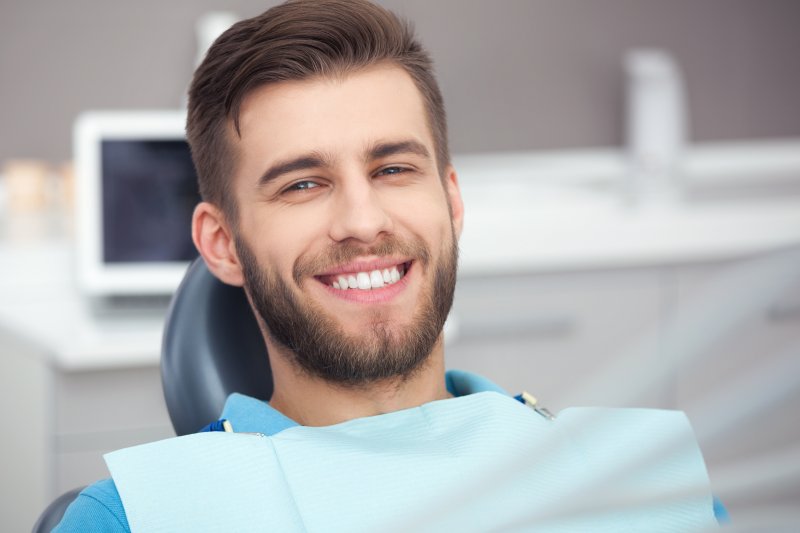person smiling after having small teeth fixed